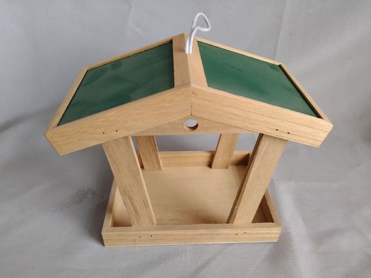 Bird feeder; Outdoor bird feeder; Wooden bird feeder; European outdoor bird feeder.